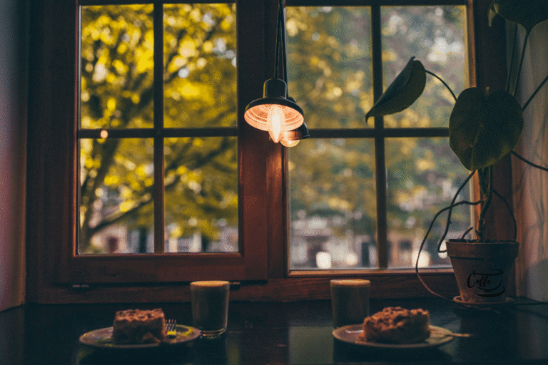A bright, modern coworking area or public library café where people are collaborating.